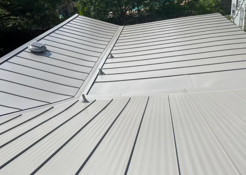Solar attic fan installed on a metal roof for Roof Ventilation in Klamath Falls